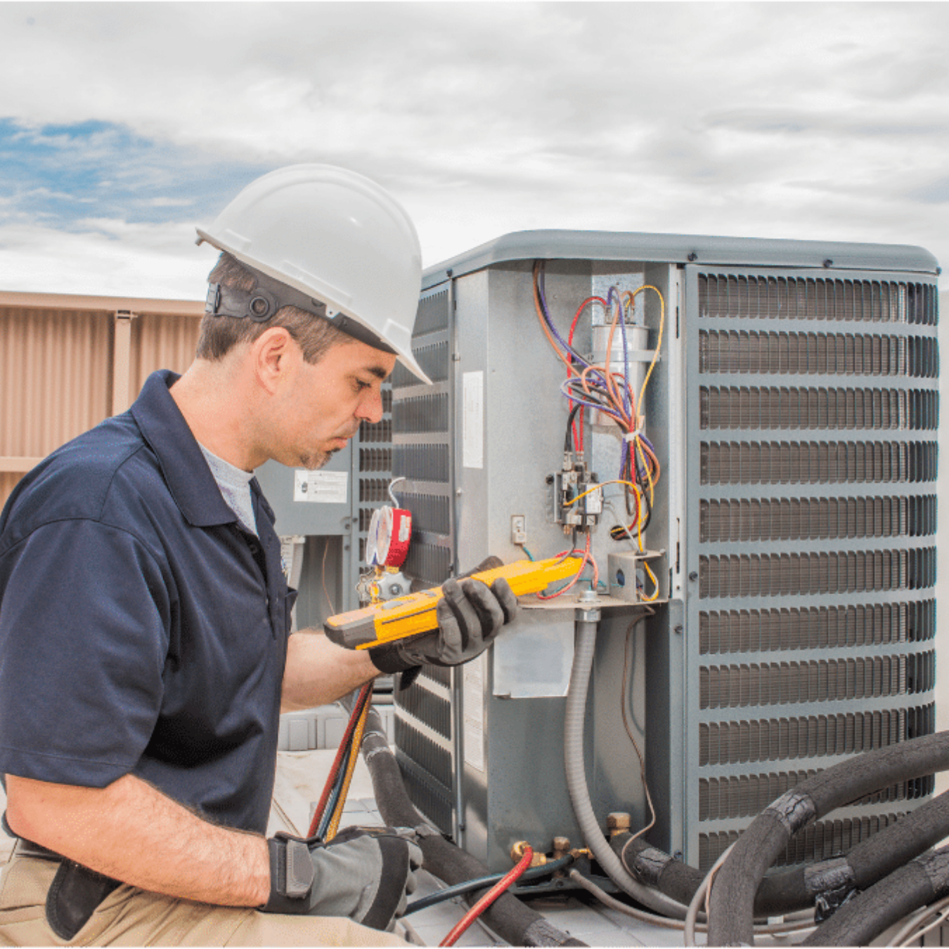 Pickering Heating & Cooling HVAC technician servicing a system